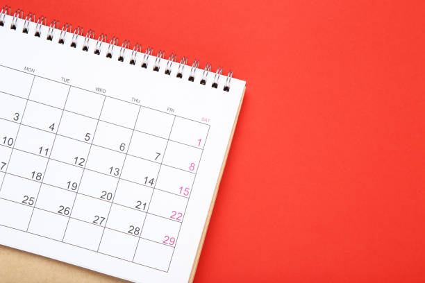 istock Paper calendar page on red background 2148184158