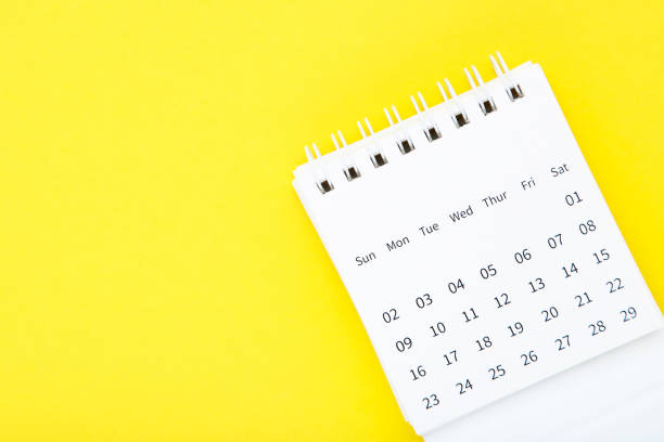 istock Paper calendar page on yellow background 2148184213