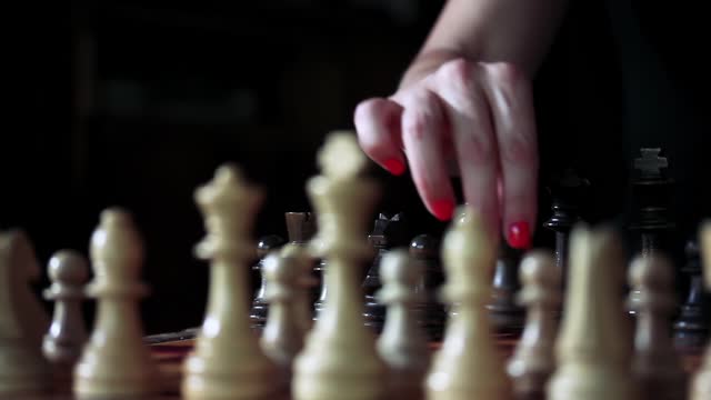 A Woman Playing Chess. Close Up. 4K Resolution.