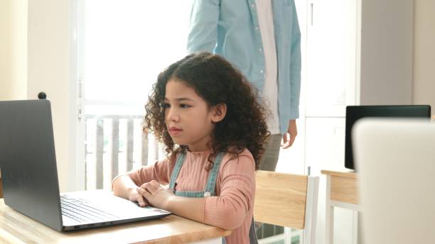istock American girl learning about prompt while student sitting at class. Pedagogy. 2148184599