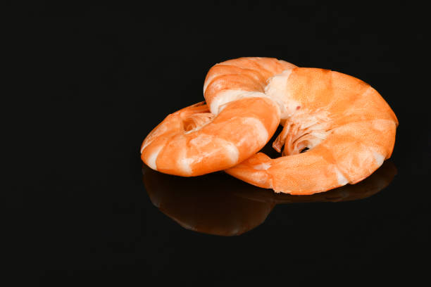 Shrimp isolated on acrylic black background. High resolution photo. Full depth of field.