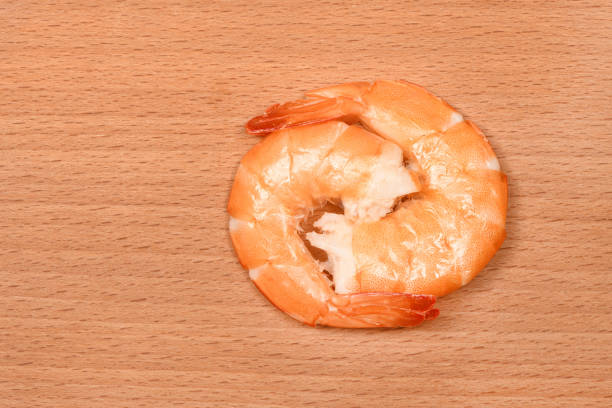 Perfectly retouched shrimp on wood background. High resolution photo. Full depth of field.