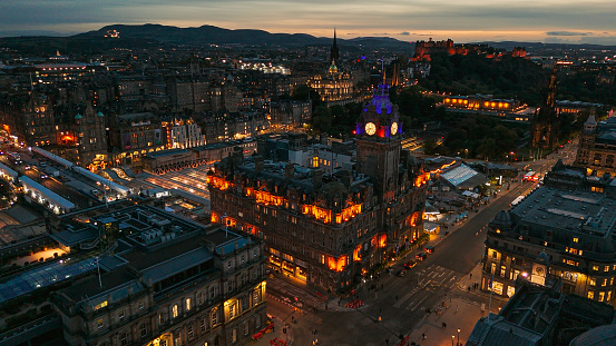 Aerial view of clock tower and scottish flag in Edinburgh old town, Aerial view of Old building in Edinburgh, Edinburgh city centre, Gothic Revival architecture in Scotland, Flag of Scotland in Edinburgh, Edinburgh city scotland at night

Edinburgh is the capital city of Scotland and one of its 32 council areas. The city is located in south-east Scotland, and is bounded to the north by the Firth of Forth estuary and to the south by the Pentland Hills. Edinburgh had a population of 506,520 in mid-2020, making it the second-most populous city in Scotland and the seventh-most populous in the United Kingdom.