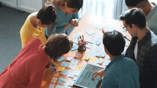 istock Top view of manager writing idea on sticky notes and explain idea. Symposium. 2148185954
