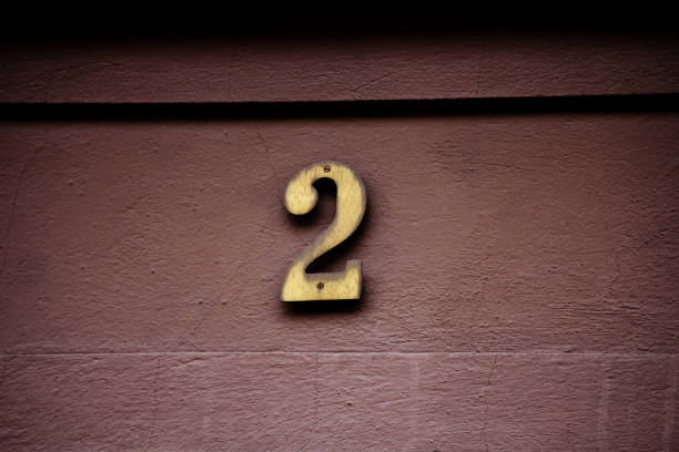 istock The number two in gold color on a wall 2148186461