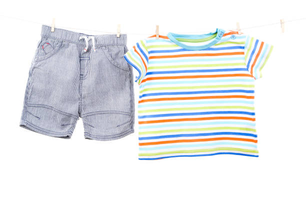 istock Baby clothes hanging on white background 2148186727