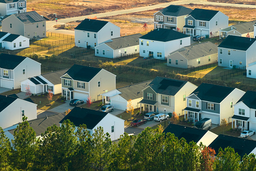 Aerial view of tightly packed homes in South Carolina residential area. New family houses as example of real estate development in american suburbs.