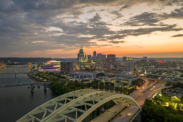 istock Highway traffic in Cincinnati, Ohio on Daniel Carter Beard Bridge with brightly illuminated high skyscraper buildings in downtown district. American city with business financial district at night 2148186787