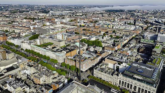 Aerial view of the Dublin spire of symbol, Dublin city centre, Aerial View of the Dublin Spire, O'Connell Street, Ireland

The Dublin Tower, alternatively called the Monument of Light, is a large, 120 meters (390 ft) high, stainless steel, pin-like monument located on the site of the former Nelson's Column (and before it a statue of William Blakeney) on O'Connell Street, the main street of Dublin, Ireland.