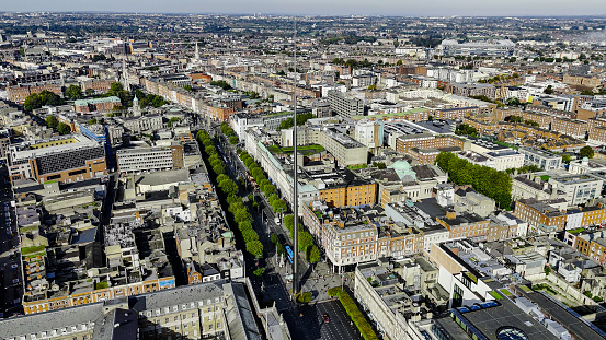 Aerial view of the Dublin spire of symbol, Dublin city centre, Aerial View of the Dublin Spire, O'Connell Street, Ireland\n\nThe Dublin Tower, alternatively called the Monument of Light, is a large, 120 meters (390 ft) high, stainless steel, pin-like monument located on the site of the former Nelson's Column (and before it a statue of William Blakeney) on O'Connell Street, the main street of Dublin, Ireland.