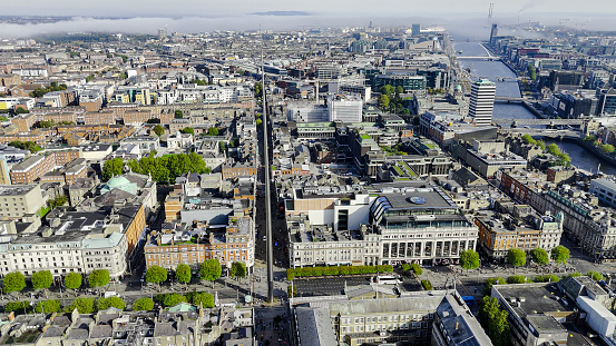Aerial view of the Dublin spire of symbol, Dublin city centre, Aerial View of the Dublin Spire, O'Connell Street, Ireland\n\nThe Dublin Tower, alternatively called the Monument of Light, is a large, 120 meters (390 ft) high, stainless steel, pin-like monument located on the site of the former Nelson's Column (and before it a statue of William Blakeney) on O'Connell Street, the main street of Dublin, Ireland.