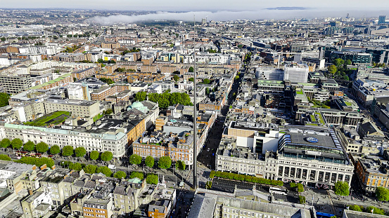 Aerial view of the Dublin spire of symbol, Dublin city centre, Aerial View of the Dublin Spire, O'Connell Street, Ireland

The Dublin Tower, alternatively called the Monument of Light, is a large, 120 meters (390 ft) high, stainless steel, pin-like monument located on the site of the former Nelson's Column (and before it a statue of William Blakeney) on O'Connell Street, the main street of Dublin, Ireland.