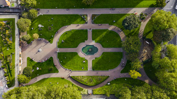 Aerial view of cathedral and park from Saint Patrick's Park-Dublin, Aerial view of historic St. Patrick's Cathedral in the heart of Ireland, Christ Church Cathedral, Aerial view of people walking in saint Patrick park, Public park fountain
Saint Patrick's Cathedral in Dublin, Ireland, founded in 1191 as a Roman Catholic cathedral, is currently the national cathedral of the Church of Ireland. Christ Church Cathedral, also a Church of Ireland cathedral in Dublin, is designated as the local cathedral of the Diocese of Dublin and Glendalough. aerial view of cathedral and park from saint patrick's park-dublin, aerial view of historic st. patrick's cathedral in the heart of ireland, christ church cathedral, aerial view of people walking in saint patrick park, public park fountain