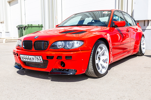 Samara, Russia - May 8, 2022: Red BMW E46 vehicle (2002) with low profile tires