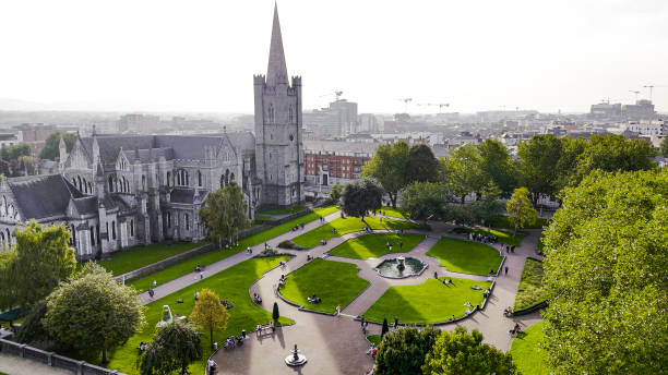 Aerial view of cathedral and park from Saint Patrick's Park-Dublin, Aerial view of historic St. Patrick's Cathedral in the heart of Ireland, Christ Church Cathedral, Aerial view of people walking in saint Patrick park, Public park fountain
Saint Patrick's Cathedral in Dublin, Ireland, founded in 1191 as a Roman Catholic cathedral, is currently the national cathedral of the Church of Ireland. Christ Church Cathedral, also a Church of Ireland cathedral in Dublin, is designated as the local cathedral of the Diocese of Dublin and Glendalough. aerial view of cathedral and park from saint patrick's park-dublin, aerial view of historic st. patrick's cathedral in the heart of ireland, christ church cathedral, aerial view of people walking in saint patrick park, public park fountain