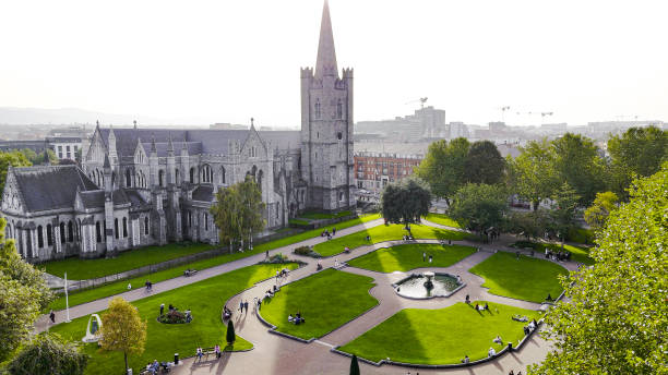 Aerial view of cathedral and park from Saint Patrick's Park-Dublin, Aerial view of historic St. Patrick's Cathedral in the heart of Ireland, Christ Church Cathedral, Aerial view of people walking in saint Patrick park, Public park fountain
Saint Patrick's Cathedral in Dublin, Ireland, founded in 1191 as a Roman Catholic cathedral, is currently the national cathedral of the Church of Ireland. Christ Church Cathedral, also a Church of Ireland cathedral in Dublin, is designated as the local cathedral of the Diocese of Dublin and Glendalough. aerial view of cathedral and park from saint patrick's park-dublin, aerial view of historic st. patrick's cathedral in the heart of ireland, christ church cathedral, aerial view of people walking in saint patrick park, public park fountain