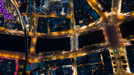 Aerial view of busy city center buildings and traffic at night, Aerial view of the river Liffey and city center Dublin Ireland at night, Aerial view of Dublin skyline and Samuel Beckett Bridge, Aerial view of Dublin city at night, Ireland

Dublin, pronounced is the capital and largest city of Ireland. On a bay at the mouth of the River Liffey, it is in the province of Leinster, bordered on the south by the Dublin Mountains, a part of the Wicklow Mountains range. At the 2016 census it had a population of 1,173,179, while the preliminary results of the 2022 census recorded that County Dublin as a whole had a population of 1,450,701, and that the population of the Greater Dublin Area was over 2 million, or roughly 40% of the Republic of Ireland's total population.