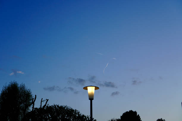 an illuminated lantern against the background of the blue sky