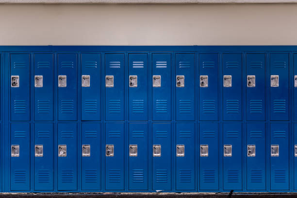 istock Empty school hallway with blue metal student lockers 2148189740