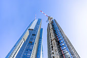 Construction of skyscrapers in the city, blue sky background with copy space