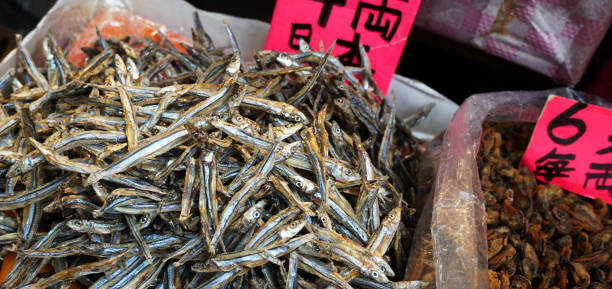 istock Small salted dried fish for sale at a Hong Kong market 2148193473