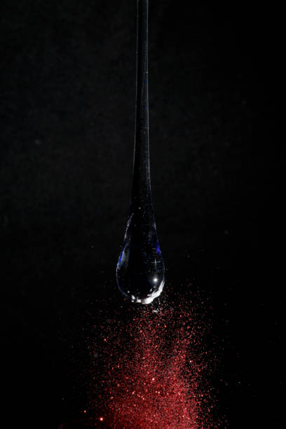 istock Blue transparent glass drop on black background 2148193928