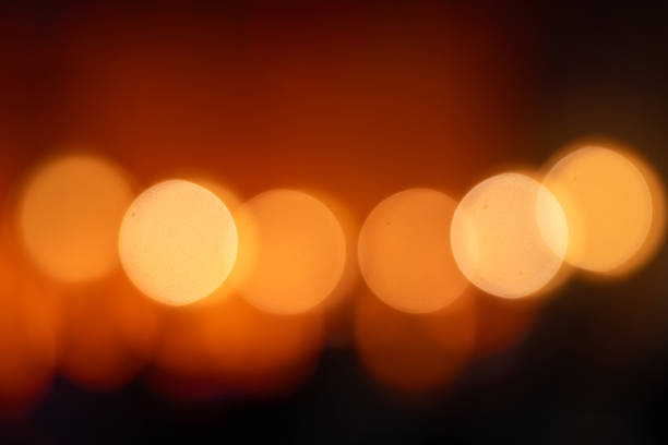 istock Golden blurred bokeh lights on black background. 2148193934