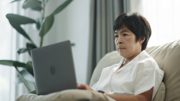 istock Asian mature woman working at home. 2148195083