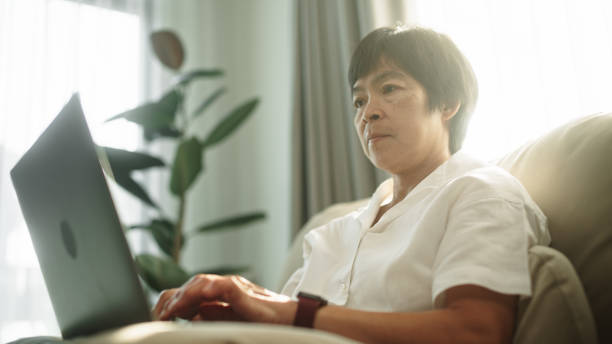 istock Asian mature woman working at home. 2148195095