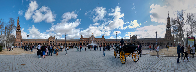 Seville, Spain - March 3, 2024: Panoramic view of the busy Plaza de España in Seville, Andalusia, Spain