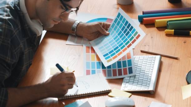 istock Designer look at screen and design color while looking at palette. Symposium. 2148198360