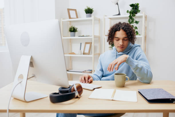 istock portrait of a man sitting in front of the computer internet online technologies 2148199122