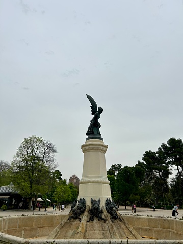 The Fountain of the Fallen Angel is a striking monument located in El Retiro Park, Madrid. Designed by Ricardo Bellver in the late 19th century, this monumental sculpture portrays Lucifer, the fallen angel, standing defiantly atop a pedestal. Cast in bronze, the statue is surrounded by a circular pool, adding to its dramatic presence within the park. Despite its controversial subject matter, the Fountain of the Fallen Angel has become an iconic landmark in Madrid, drawing visitors who are intrigued by its artistic and symbolic significance.
