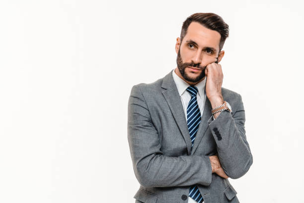 istock Stressed young businessman feeling sad isolated over white background. 2148199579