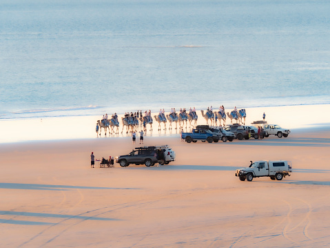 Camel train at sunset on Cable Beach Broome Western Australia
