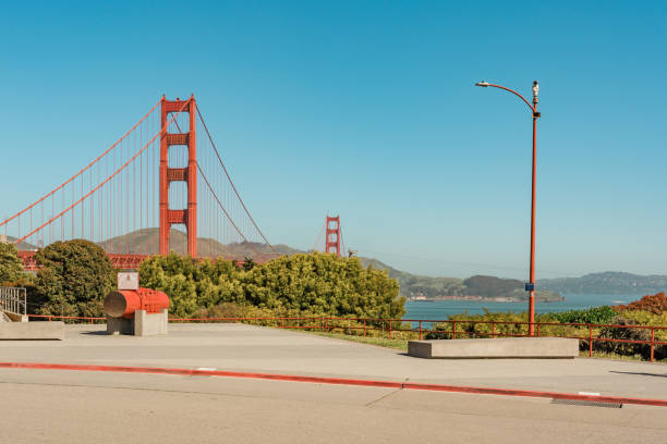 Golden Gate Bridge viewed from a vantage point with a blue sky in the background.