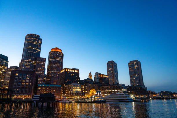 Illuminated Skyline of Boston Harbor at Dusk