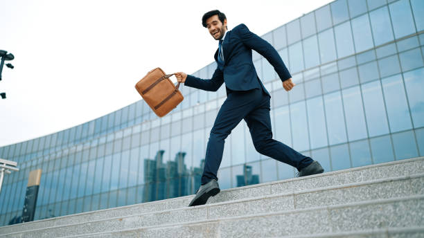 istock Successful business man celebrate increasing sales while standing. Exultant. 2148204264