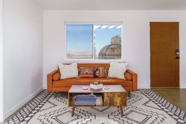 istock Living room with leather couch, coffee table, designer southwest rug 2148204331