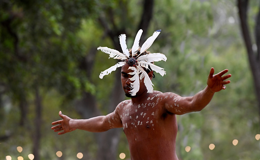 Laura, Qld - July 08 2023:Indigenous Australians man on ceremonial dance in Laura Quinkan Dance Festival Cape York Australia. Ceremonies combine dance, song, rituals, body decorations and costumes