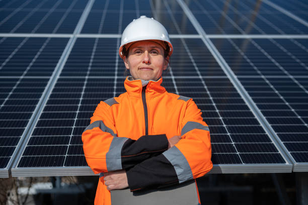 istock Eco Mind. Female Engineer Portrait on Solar Panels Background. 2148210142