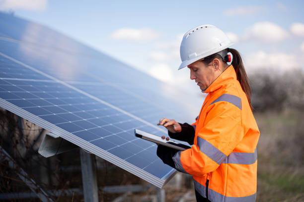 istock Green Energy. Female Engineer in Solar Power Plant. 2148210150