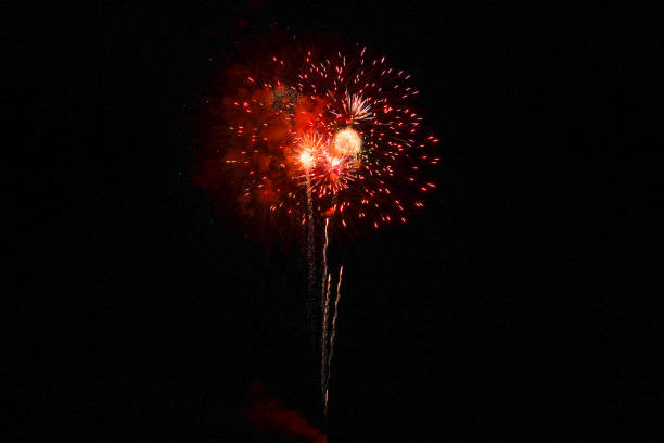 istock Red firework explosion in the night sky on the 4th of July 2148210247