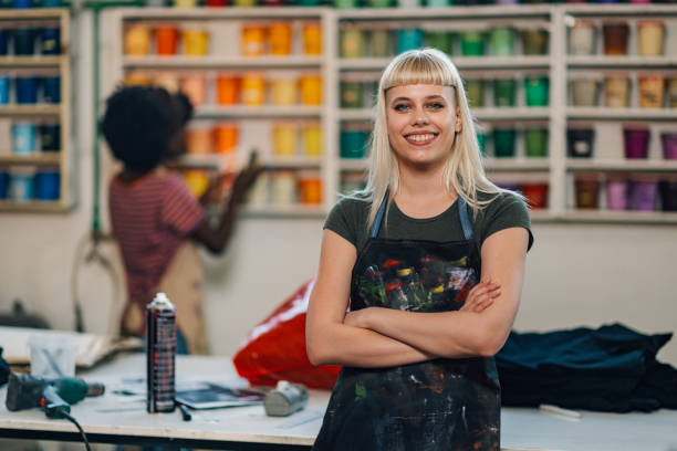 istock Confident print shop entrepreneur with arms folded smiling at the camera 2148210282