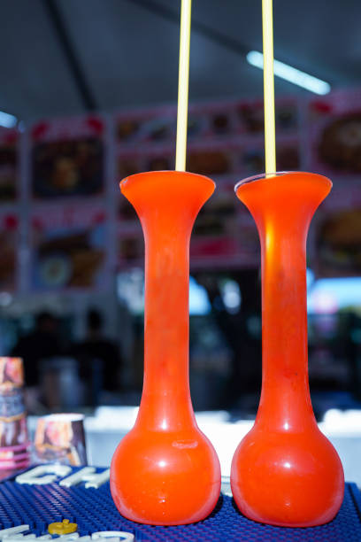 istock Two tall red daiquiri cups with straws 2148211775