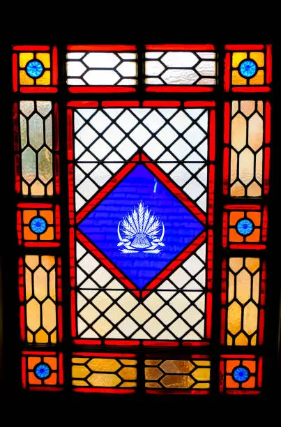 Beautiful red, yellow, and blue stained glass window pane