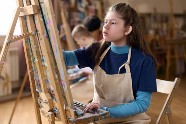 istock Girl with Disability Enjoying Art Class 2148215039