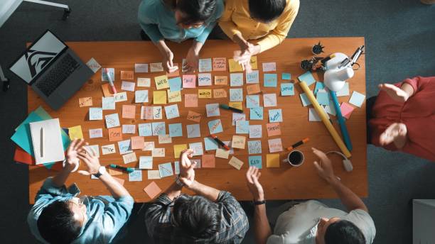 istock Top view of manager looking idea on sticky notes and explain idea. Symposium. 2148215587