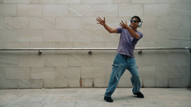 istock Hipster listen music while move or dance to music at dancing room. Sprightly. 2148217614