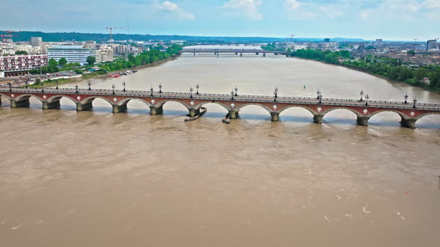 Aerial view of Iconic city square and Pont de Pierre bridge in Bordeaux, France.